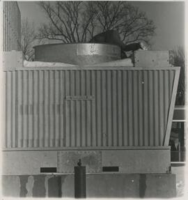Person hanging into piece of machinery