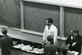 Group in front of a chalk board