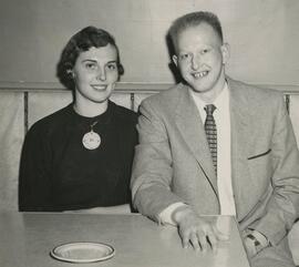 Two students sitting at a table.