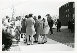 Students gathered outside of residence hall.