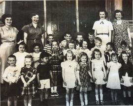 Campus School posing outside building