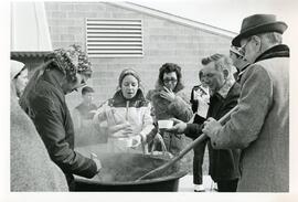 Serving bean soup.