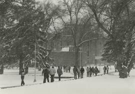 Students walking through the snow.