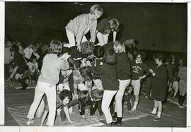 Students making a human pyramid,