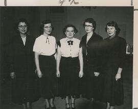 Group of women standing.