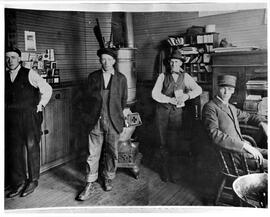 River Falls railroad depot interior: from L to R; unknown, Harry Lunger, __ Ledemen (freight agen...