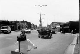 Traffic and businesses on Main Street in River Falls, 1990
