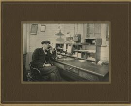 John James Stephens in office at Railroad Depot in Spooner (?), Wisconsin