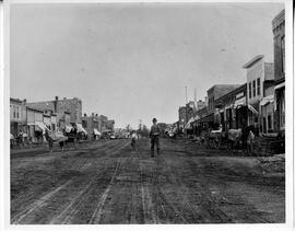 Man and boy on North Main Street in River Falls, circa 1891