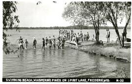 Swimming beach at Whispering Pines resort on Spirit Lake, Frederic, Wisconsin