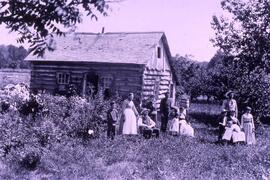 James Murray family in front of log cabin, Eau Galle Township, Dunn County, circa 1890