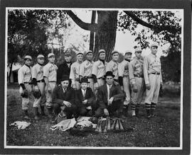 Hudson: people, Hudson booster baseball team, l to r, Shim Gordon, Wood R. Foss, Iver A. "Silver" Severson, Cullie Nelson, Car Lee, Heinie Bleier, Melvin (Minna) M. Peterson, Frosty Bersch, Harry L. Goldberg, Minna Solheim, Oswald (Plumber) Solheim, kneeling l to r, Ben Alm, Oscar D. (Knobs) Olson, Frank Gilbertson, 1913