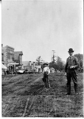 Man and boy on Main Street in River Falls, 1891