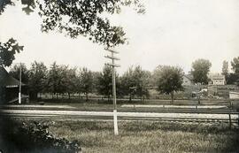 View showing depot, train tracks, and several buildings, Diamond Bluff, Wisconsin